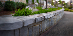 Stone Work Retaining Wall On Lawn