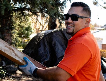 Altitude Hauling Crew Member Holding Garbage