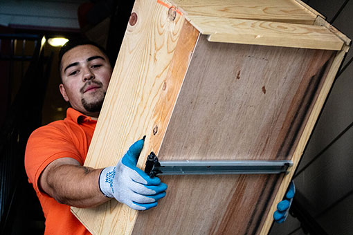 An Altitude Hauling service professional completes a old furniture removal job