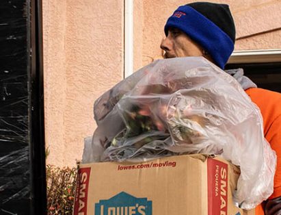 Altitude Hauling Crew Member With Yard Waste