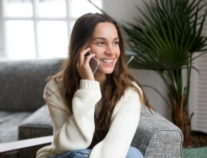 Woman on the phone scheduling junk removal services